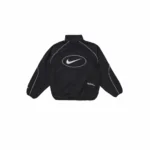Supreme x Nike Track Jacket warna hitam dengan logo bordir di dada, model relaxed fit berbahan ringan dan tahan angin.