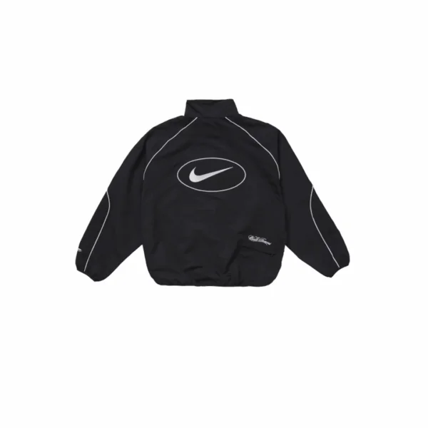 Supreme x Nike Track Jacket warna hitam dengan logo bordir di dada, model relaxed fit berbahan ringan dan tahan angin.
